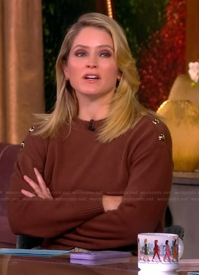 Sara’s brown sweater with gold shoulder buttons on The View