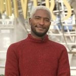 Scott’s red mock neck sweater on Access Hollywood