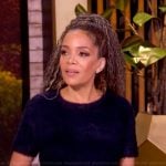 Sunny’s navy cashmere top and skirt on The View