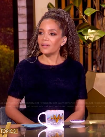 Sunny’s navy cashmere top and skirt on The View