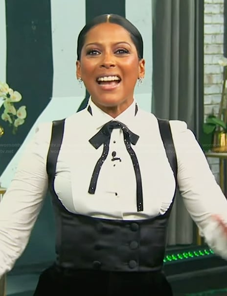 Tamron's white tuxedo blouse and vest on Tamron Hall Show
