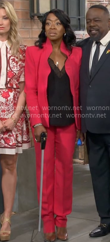 Tina's red ruffled suit on The Neighborhood