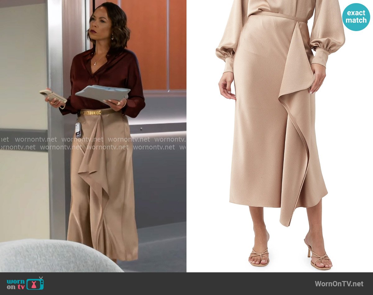 Nicole’s beige draped skirt on Beyond the Gates