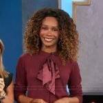 Zuri's burgundy bow cardigan on Access Hollywood