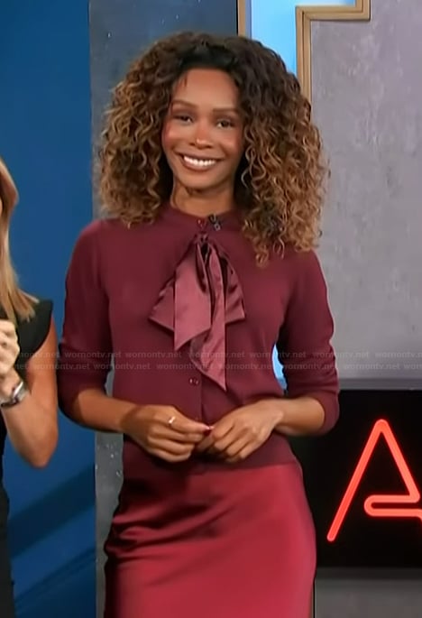 Zuri’s burgundy bow cardigan on Access Hollywood