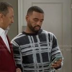 Andre’s checked print sweater on Beyond the Gates