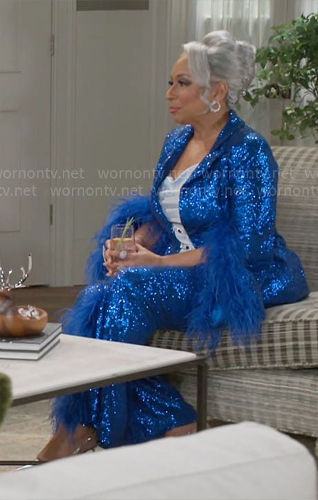 Anita’s blue sequin suit with feather trims on Beyond the Gates