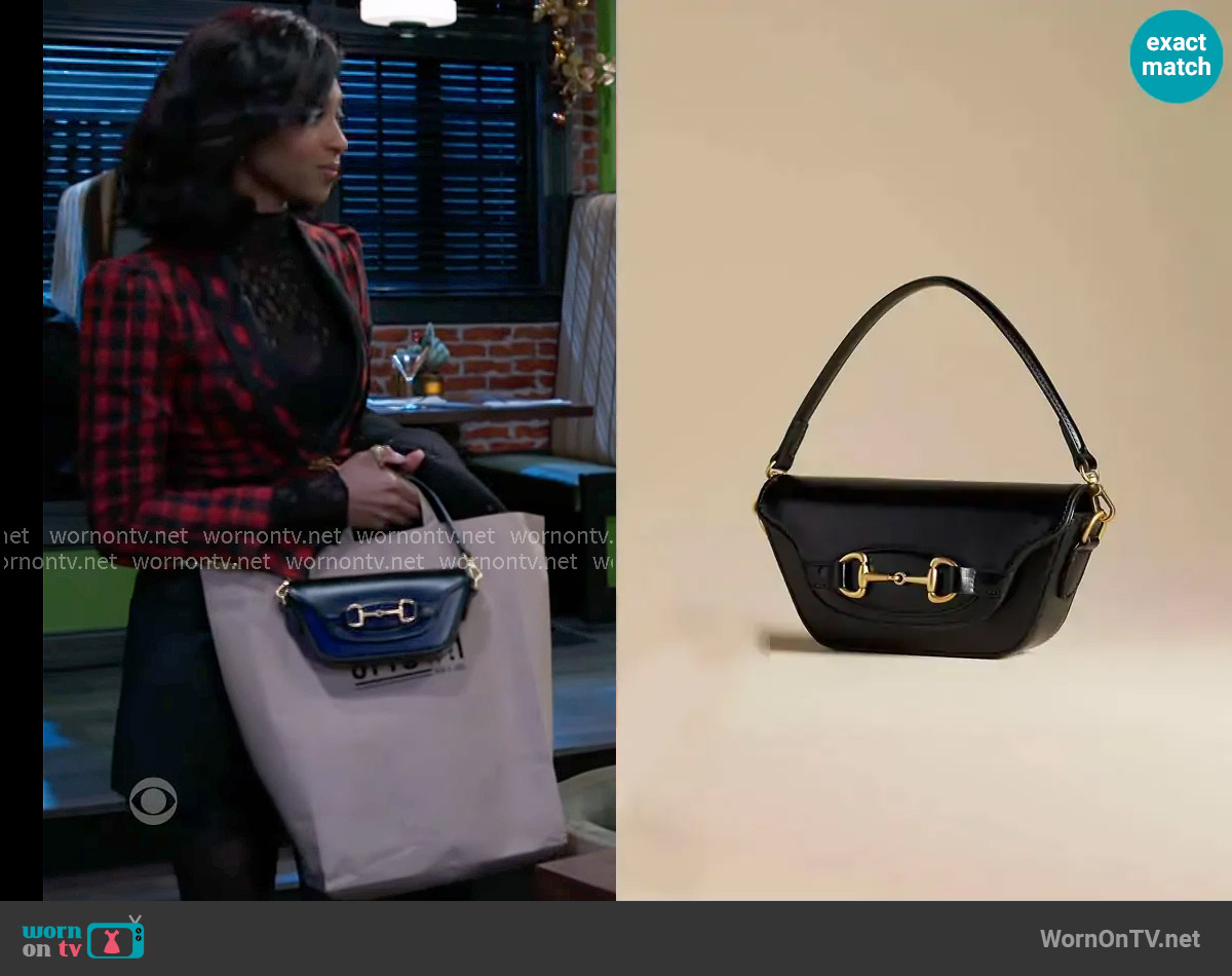 Anthropologie The Delilah Bag Horsebit Edition worn by Kat Richardson (Colby Muhammad) on Beyond the Gates