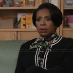 Barbara’s black floral print tie neck blouse on Abbott Elementary