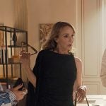 Sylvie's black one-shoulder draped dress on Emily in Paris