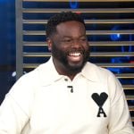 EJ’s white polo sweater on Access Hollywood