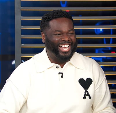 EJ’s white polo sweater on Access Hollywood