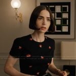 Emily’s black floral print sheath dress on Emily in Paris