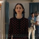 Emily’s black and red moon print cardigan and skirt on Emily in Paris