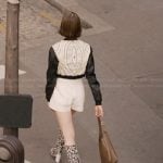 Emily’s floral boots and leather bag on Emily in Paris