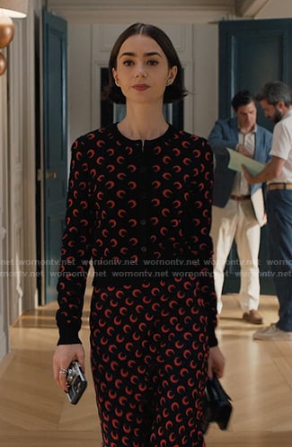 Emily's black and red moon print cardigan and skirt on Emily in Paris