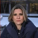 Erin McLaughlin’s navy hooded zip puffer jacket on Today