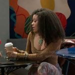 Eva’s mustard yellow top and printed mesh skirt on Beyond the Gates