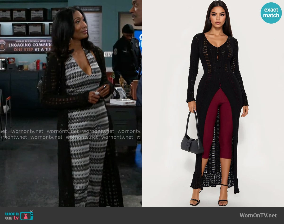 Leslie’s black long cardigan on Beyond the Gates