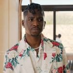 Julien’s white rose print blazer ands pants on Emily in Paris