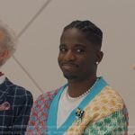 Julien’s multicolor check knit cardigan on Emily in Paris