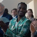 Julien’s green metallic blazer on Emily in Paris