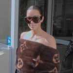 Kim’s monogram fur scarf on The Kardashians