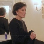 Kris's black floral sleeve top on The Kardashians