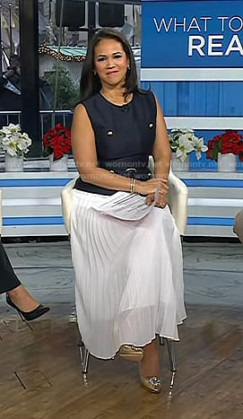 Laura’s navy vest and white pleated skirt on Today