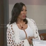 Leslie’s white crochet cardigan with fringed trims on Beyond the Gates