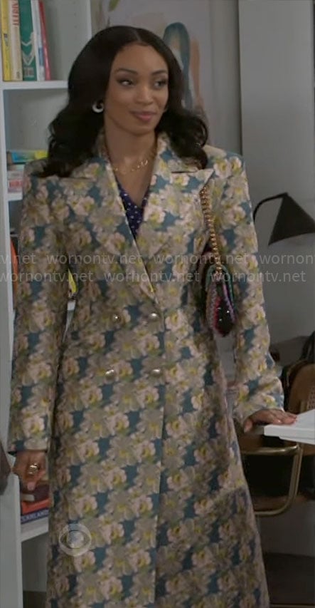 Madison’s long floral coat on Beyond the Gates