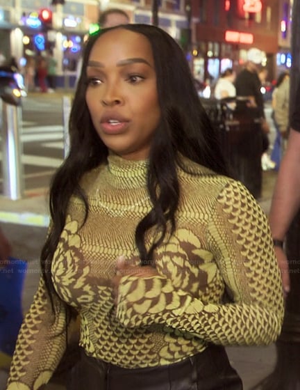 Malika’s green printed mesh top on The Kardashians