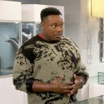 Marty’s green and black abstract print sweater on The Neighborhood