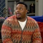 Marty’s orange chevron print cardigan on The Neighborhood