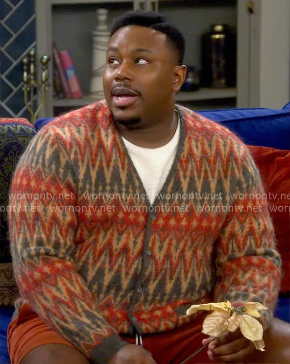 Marty's orange chevron print cardigan on The Neighborhood