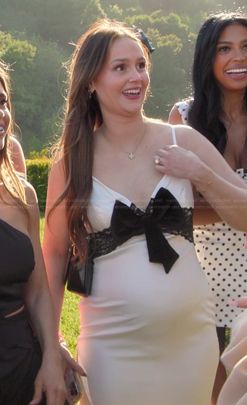 Mikayla's white dress with contrast bow on The Kardashians