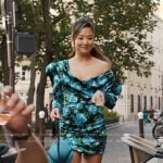 Mindy’s black and blue rose print mini dress on Emily in Paris