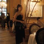 Mindy’s black sweetheart dress on Emily in Paris