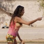 Mindy’s fruits print shorts and pink chunky platform pumps on Emily in Paris