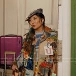 Mindy’s print trench coat and blue cutout top on Emily in Paris