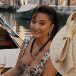 Mindy’s mixed print flare dress on Emily in Paris