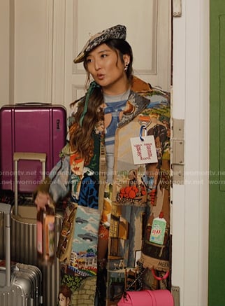 Mindy’s print trench coat and blue cutout top on Emily in Paris