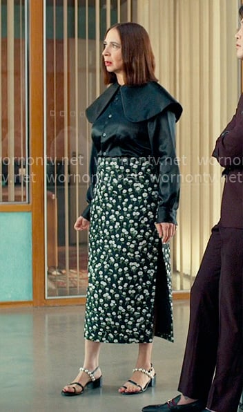 Molly's black shirt with oversized collar and daisy print skirt on Loot