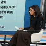 Natalie’s black sweater and brown belted pleatd skirt on Today