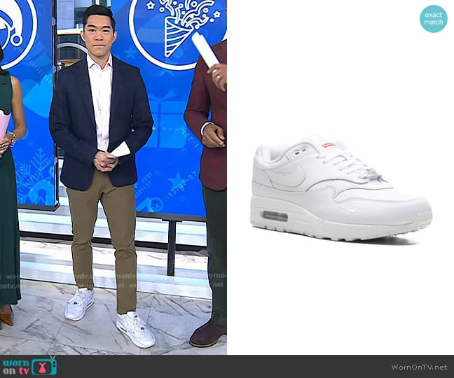 Brian Cheung’s white sneakers with red tag on Today