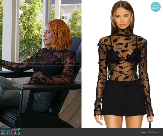 Norma Kamali Long Sleeve Turtleneck Top in Black Leaf worn by Whitney Rose on The Real Housewives of Salt Lake City