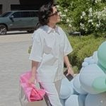 Kris’s white striped pants on The Kardashians