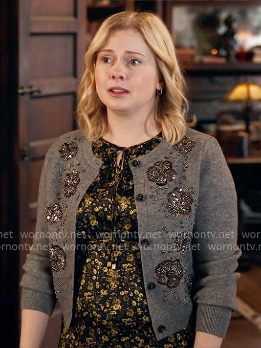 Sam’s floral dress and grey embellished cardigan on Ghosts