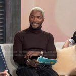 Scott’s brown turtleneck and navy striped pants on Access Hollywood