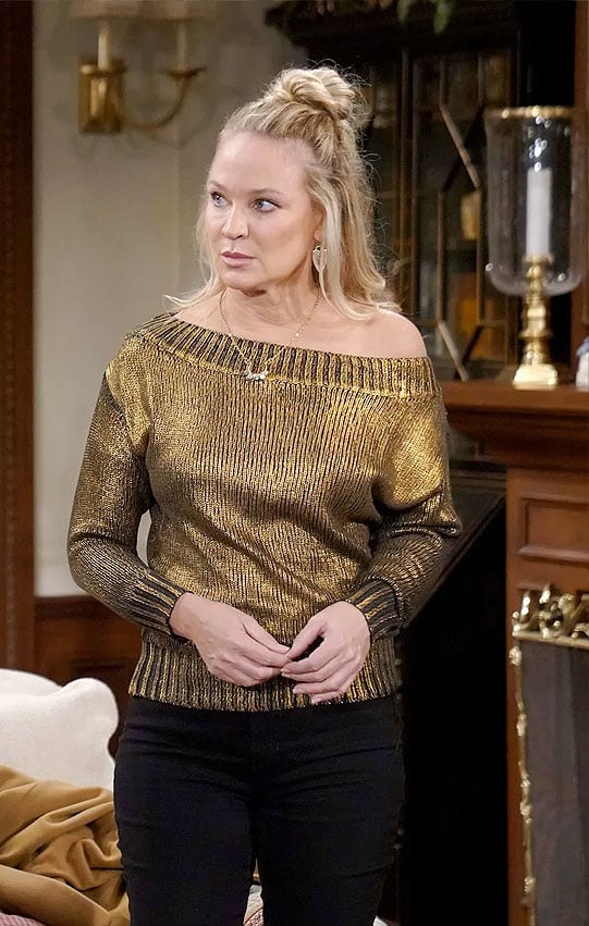 Sharon’s gold one-shoulder sweater on The Young and the Restless